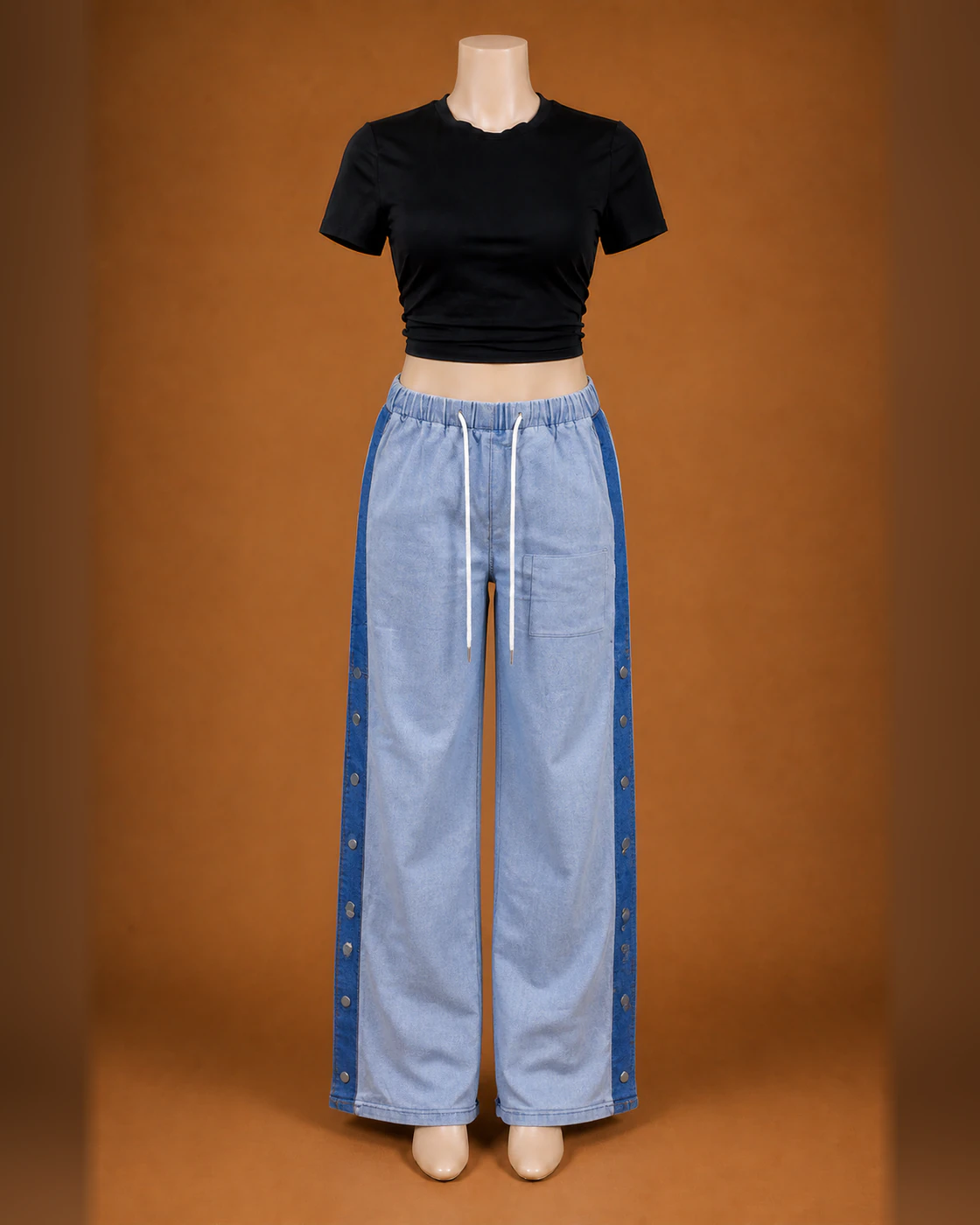 Black Cropped Tee and Light-Wash Snap-Panel Trousers Set · on mannequin.