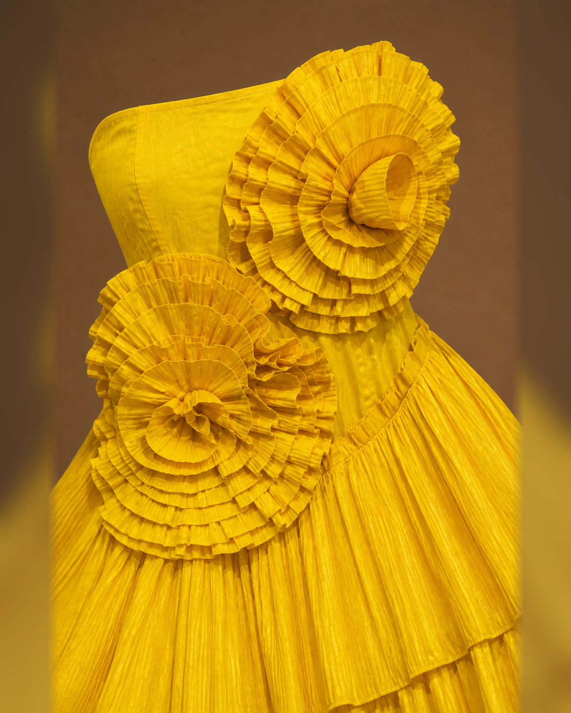 Marigold Sculptural Rosette Strapless Mini Dress · fabric detail.